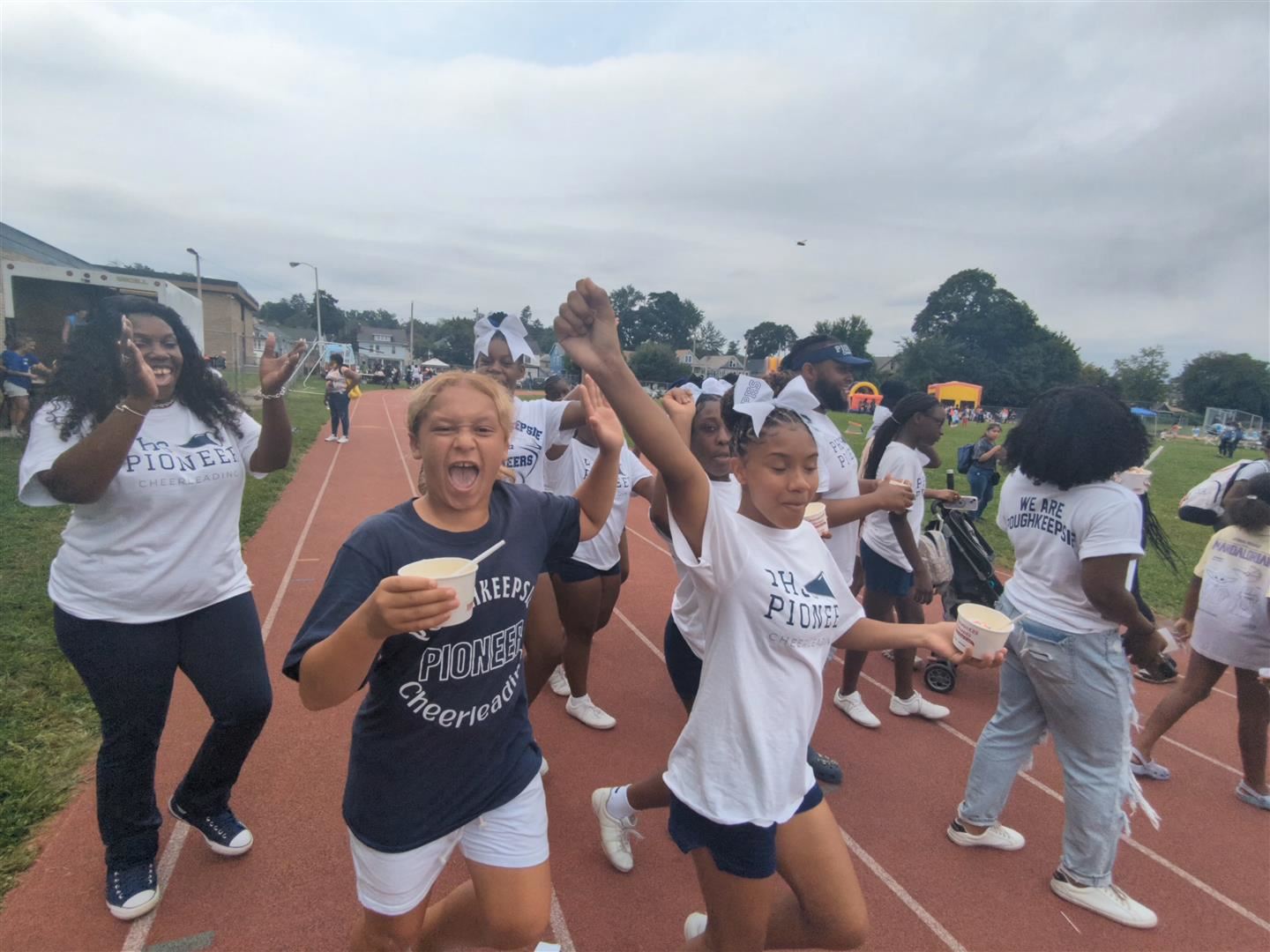 Poughkeepsie Pioneer cheerleaders hang out at the Back to School Bash.