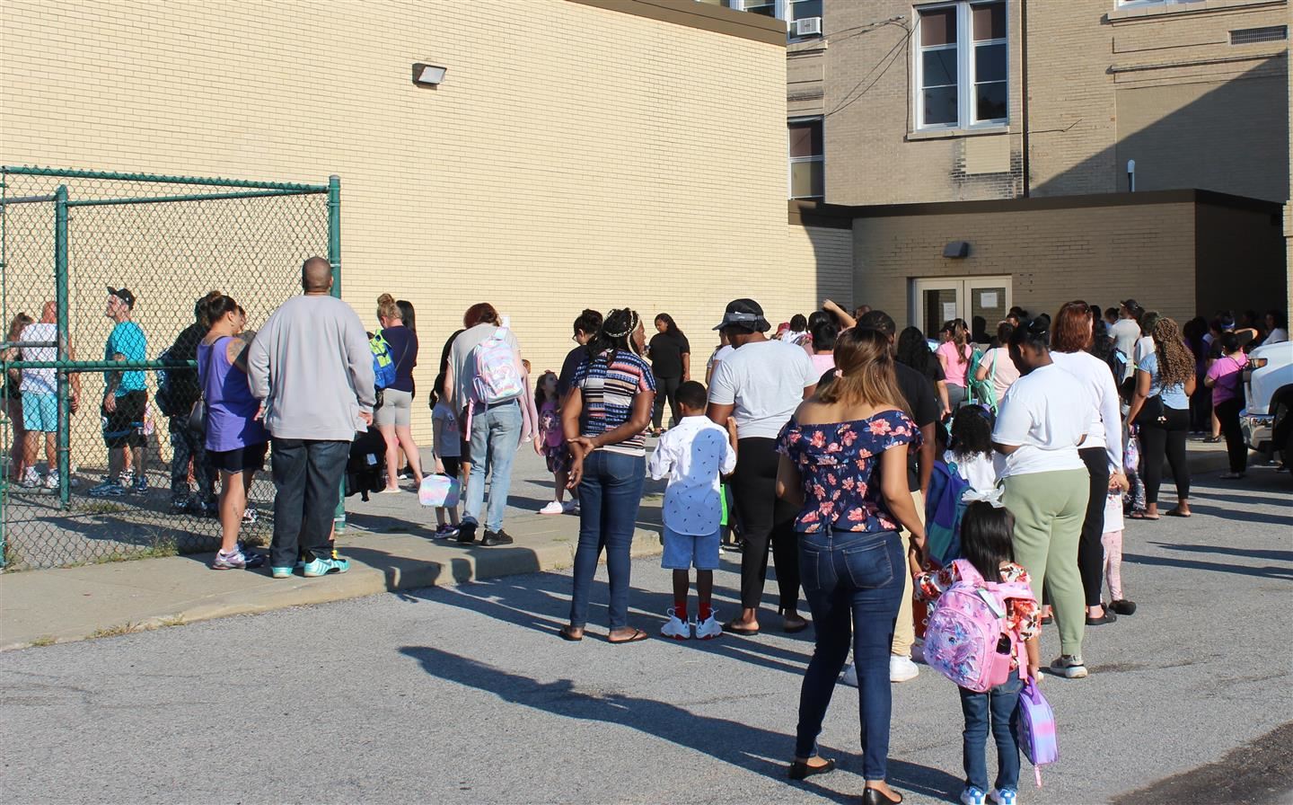  Parents wait with their children to enter the Early Learning Center on the first day of school