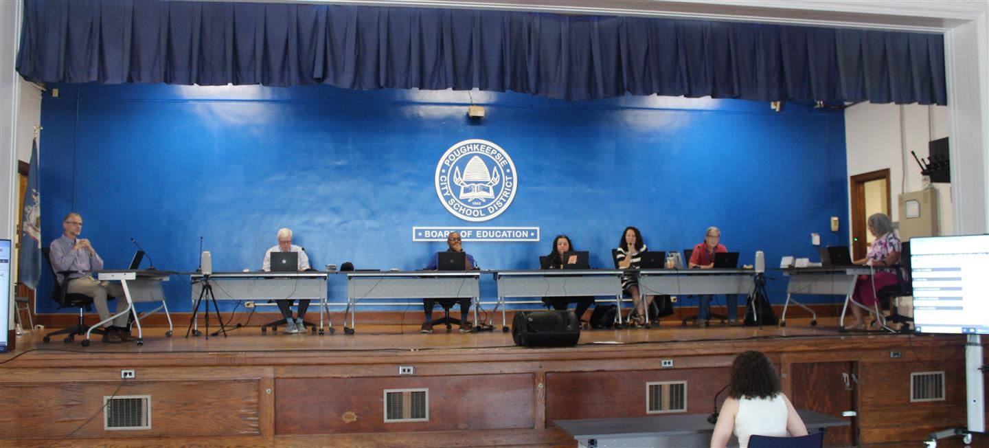 The Board of Education listens to a resident