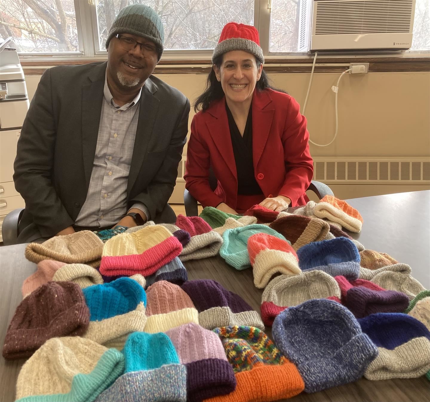 Dr. Eric Jay Rosser and Karen Hochhauser pose with, and in, winter hats