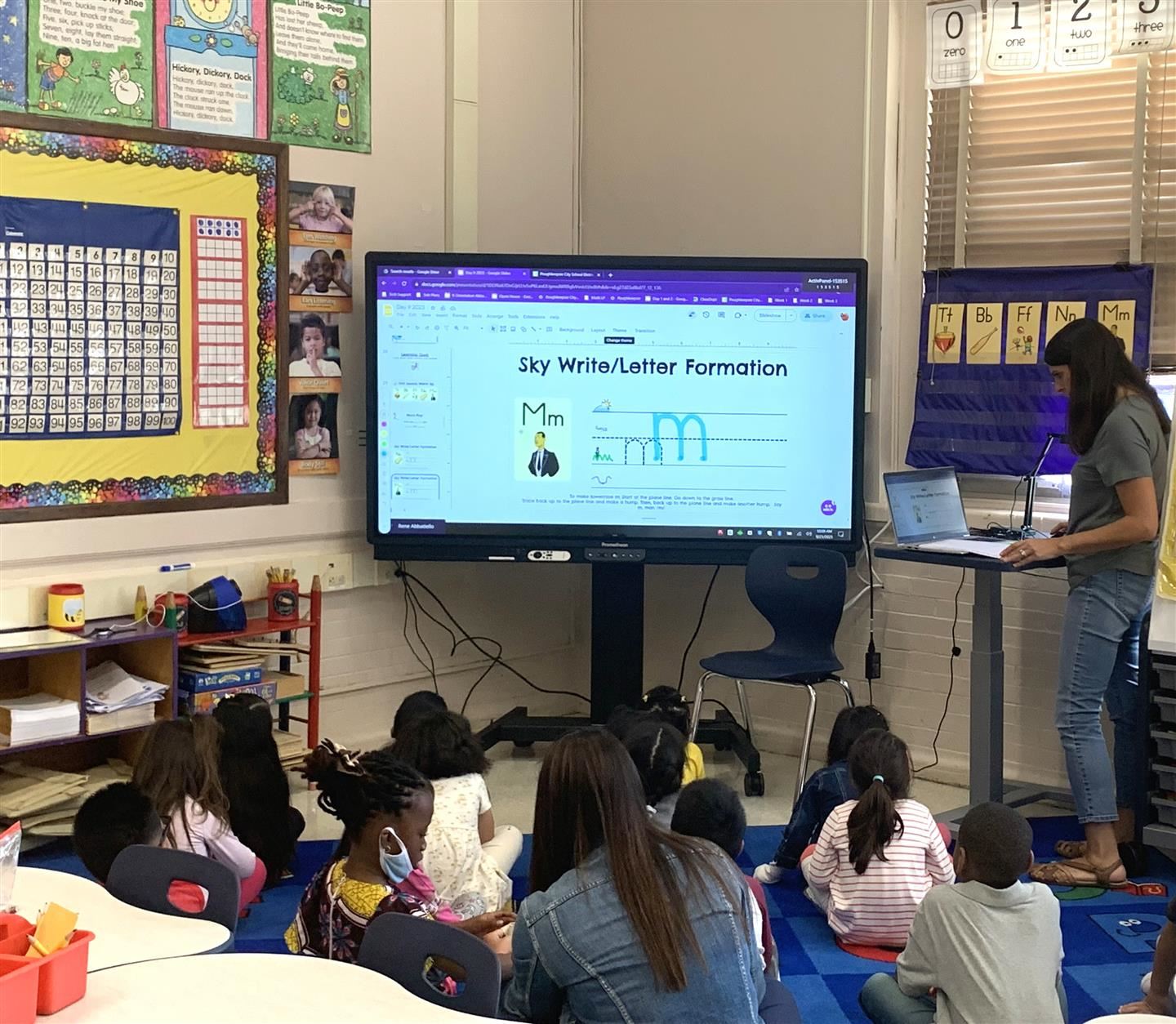 Administrators observe an Early Learning Center classroom as part of instructional rounds.