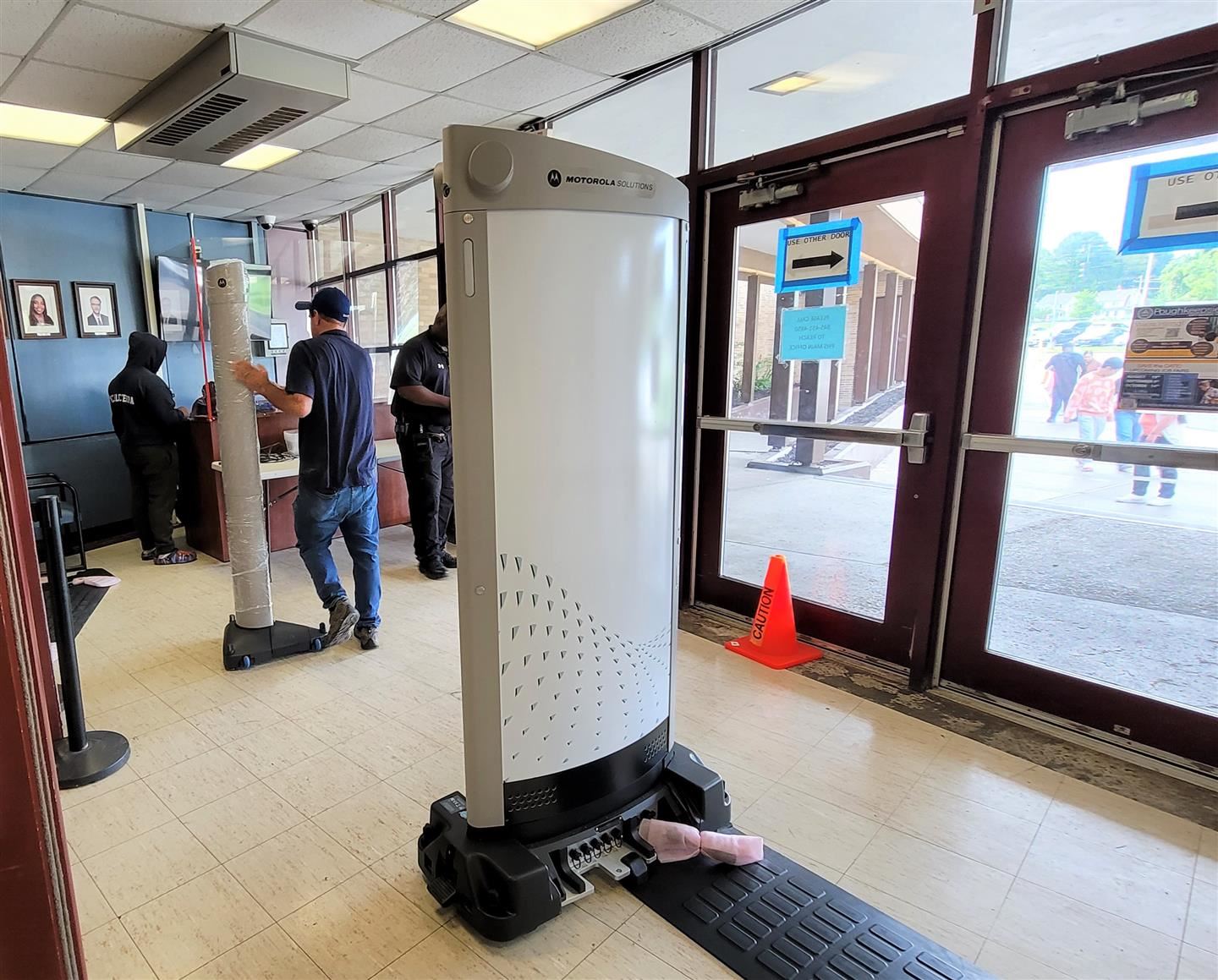  A Day Automation worker installs a new safety scanner at Poughkeepsie High School