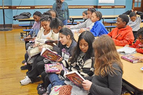 Some Clinton students couldn’t wait to get into their copy of “Nic Blake and the Remarkable: The Manifestor Prophecy.”